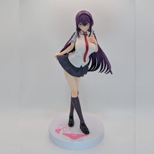 Anime Schoolgirl Figure with Purple Hair and Navy Skirt